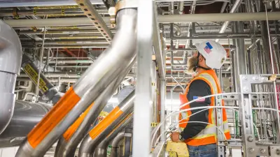 A worker testing system in the sub-fab of a semiconductor manufacturing facility. 